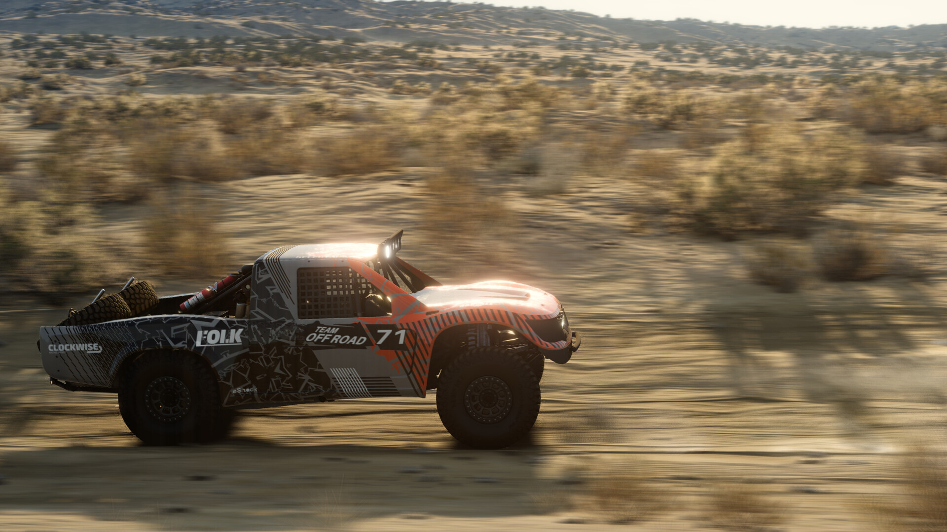 Varios vehículos realizando un salto en cadena en un escenario de pruebas